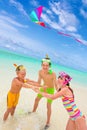 Children flying kite in sea Royalty Free Stock Photo