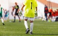 Children Football Goalkeeper on a Game. Young Boys in Goalie Uniform and Soccer Gloves