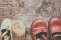 Children footwear on vintage wood background Royalty Free Stock Photo