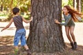 Children, forest or playing tag for fun with brother and sister sibling outdoor in nature together. Kids, girl and boy Royalty Free Stock Photo