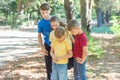 Children in the forest use a compass to study the direction of movement. The concept of children and adolescents outdoor