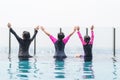 Children friendship concept with happy girl kid group having fun playing together in swimming pool on rooftop hotel Royalty Free Stock Photo