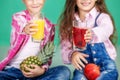 Children with fruit juice and pineapple and pomegranate. The con
