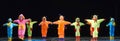 Children in funny colored overalls aliens dancing on stage Royalty Free Stock Photo