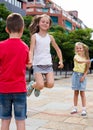 Entertaining children's games. A boy jumps over a rope Royalty Free Stock Photo