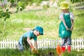 Children gardening and watering