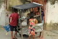 Children are gathered around a local pickle seller vehicle or selling cart at barasat, kolkata.