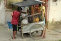 Children are gathered around a local pickle seller vehicle or selling cart at barasat, kolkata.