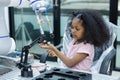 children girl with afro hairstyle robotics class for education on table at class room. learning innovation electronic for future Royalty Free Stock Photo