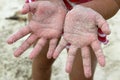 Children girl beach sand hands facing camera