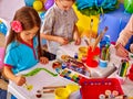 Children girl and boy with brush painting in primary school.