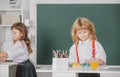 Children girl and boy drawing with coloring pens. Cute school kids painting in class at school. Painting lesson, drawing Royalty Free Stock Photo