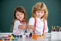 Children girl and boy drawing with coloring pens. Cute school kids painting in class at school. Painting lesson, drawing Royalty Free Stock Photo