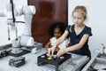 Children girl caucasoid and girl African American education electronic robotic arm on table at class room. learning innovation