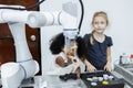 Children girl caucasoid and girl African American education electronic robotic arm on table at class room. learning innovation