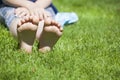 Children girl foot grass background Royalty Free Stock Photo
