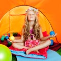 Children girl inside camping tent relax yoga