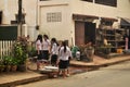 Children girl Laotian people group prepare water for playing songkran festival day on street after finish class from school in Royalty Free Stock Photo