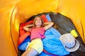 Children girl lying on camping tent