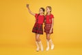 Children girls hold smartphone. Taking selfie photo. Fashion blog. Blog online. Smartphone application concept. Blogger