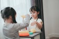 Children girls play a toy games in the room