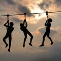 Children gliding on the flying fox contraption against a blue cl