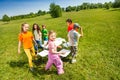 Children go around playing musical chairs outside