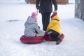 Children go sledding in winter .Winter entertainment and recreation