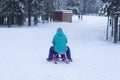 Children go sledding in winter .Winter entertainment and recreation