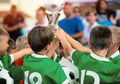 Children in Green Sportswear Celebrating Sport Success.