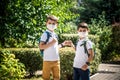 Children greeting. Kids wearing mask and backpacks protect and safety coronavirus for back to school. Bou and girl going school