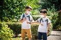 Children greeting. Kids wearing mask and backpacks protect and safety coronavirus for back to school. Bou and girl going school