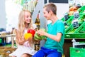 Children grocery shopping in corner shop Royalty Free Stock Photo