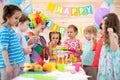 Children group with clown celebrating birthday party Royalty Free Stock Photo