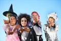 Children, group and hands in halloween costume for sweet candy asking, trick or treat for fantasy. Friends, smile and Royalty Free Stock Photo