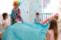 Children group have fun with clown on birthday party Royalty Free Stock Photo