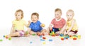 Children group playing toy blocks. Small Kids on w