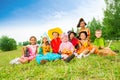 Children in Halloween costumes sit together Royalty Free Stock Photo