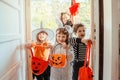 Children in Halloween costumes, trick or treating Royalty Free Stock Photo