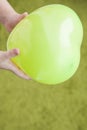 Children hand balloon wool background