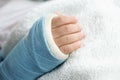 Children hand bone broken with arm splint
