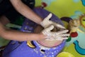 Children hand playing with clay to make pottery Royalty Free Stock Photo