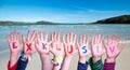 Children Hands Building Word Exklusiv means Exclusive, Ocean And Sea