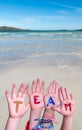 Children Hands Building Word Team, Ocean Background Royalty Free Stock Photo