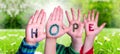 Children Hands Building Word Hope, Grass Meadow