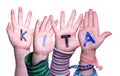 Children Hands Building Word KITA Means Kindergarden, Isolated Background