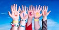 Children Hands Building Word Liebe Means Love, Blue Sky
