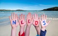 Children Hands Building Word Needs, Sea And Ocean Background Royalty Free Stock Photo