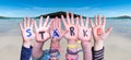 Children Hands Building Word Staerke Means Strength, Ocean And Sea