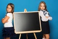 Children with hands crossed, copy space. Girls in school uniform